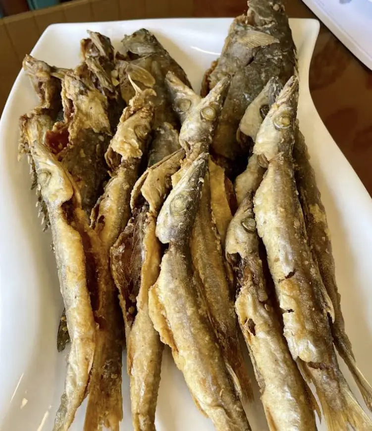 A platter of whole fish fried crisp, served at The Sailor Woman